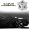 A metallic cube brake caliper compression tool is shown next to a black sports car body.