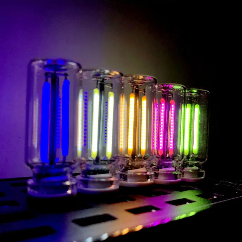 A row of USB touch dimmable LED night lights glowing in various colors on a dark surface.
