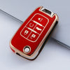 A red TPU key fob case with gold accents showing various key cutouts for Chevrolet and GMC models.