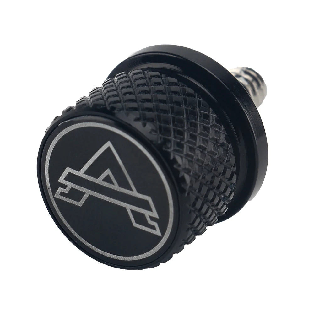Black aftermarket motorcycle seat and fender bolts with a textured surface and a silver logo.