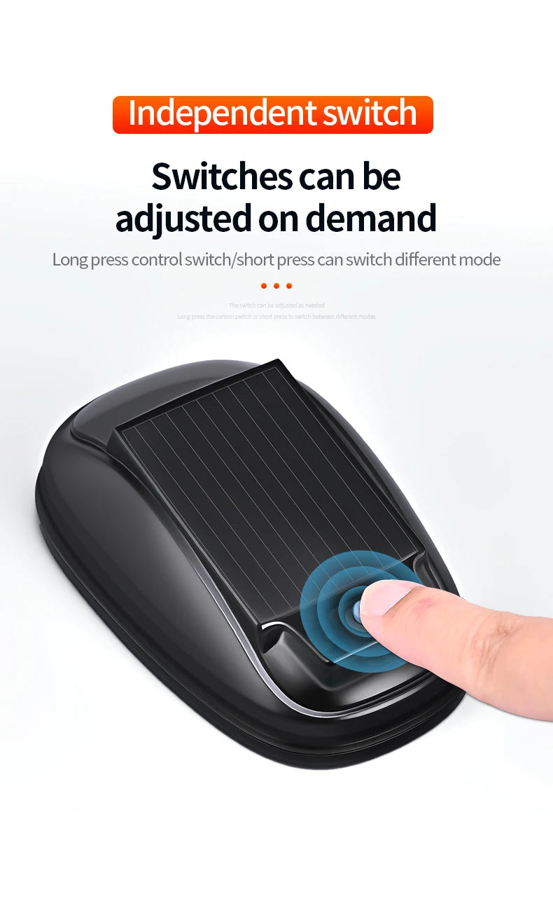 A close-up of a black solar roof strobe warning light switch being pressed by a finger.