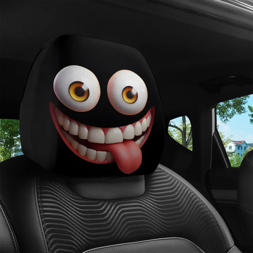 A black cartoon character with big eyes and a tongue sticking out is displayed on a car headrest cover.