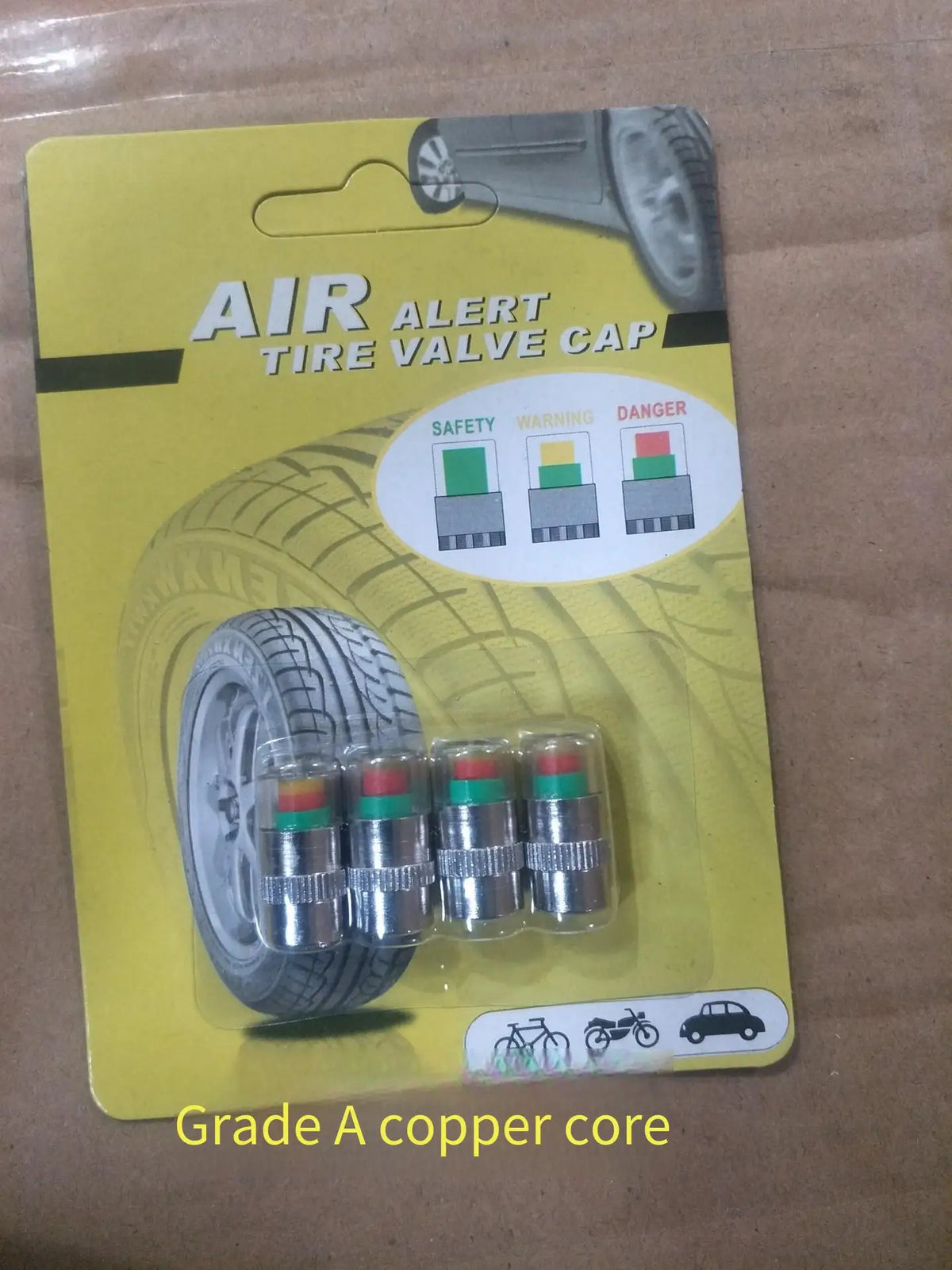 Un paquet de bouchon de valve de pneu Air Alert avec avertissements de sécurité et un cœur en cuivre de grade A.
