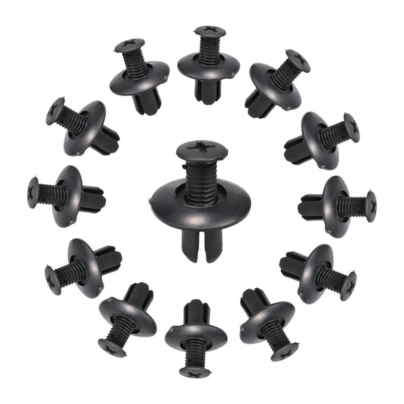 A collection of black plastic fasteners used for vehicle trim.