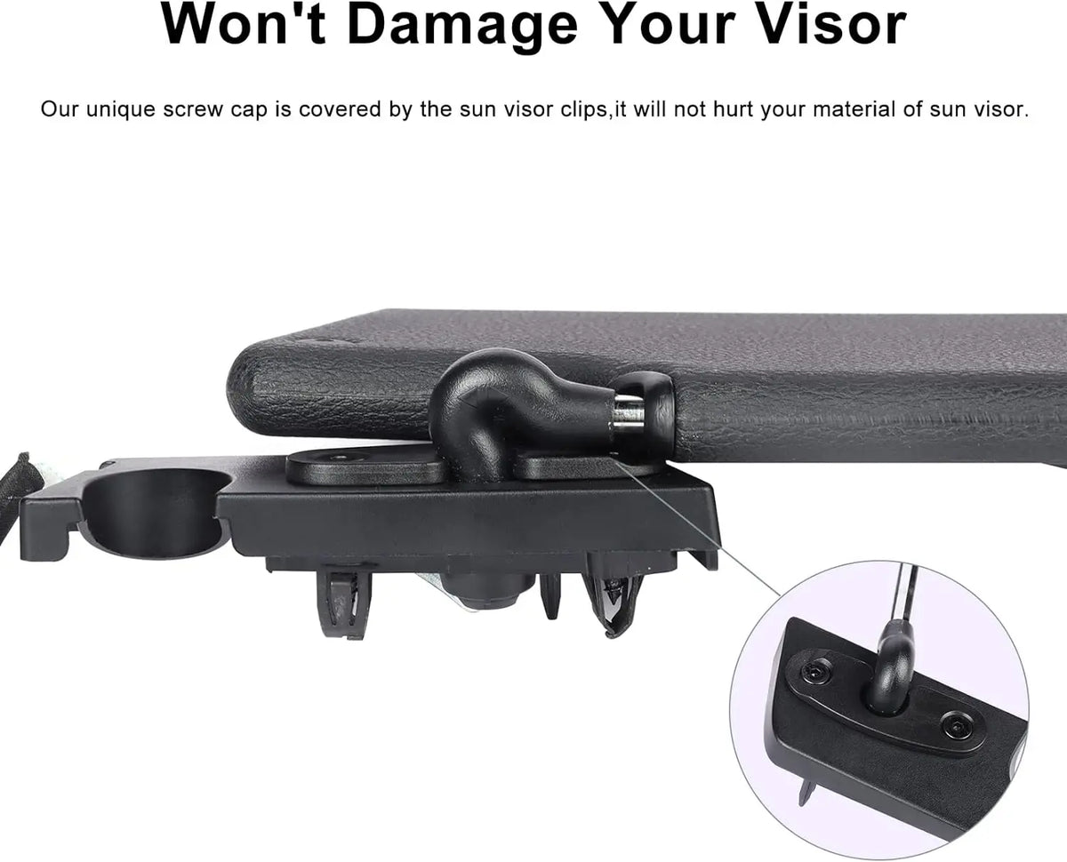 A close-up view of a black screw cap covering the sun visor clips on a vehicle.