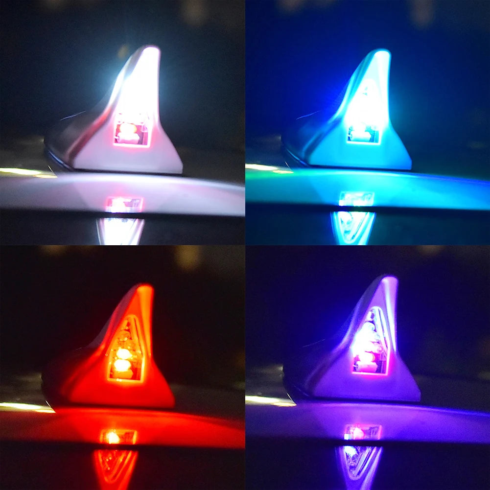 Close-up view of a solar powered LED warning tail light antenna reflecting on a surface.