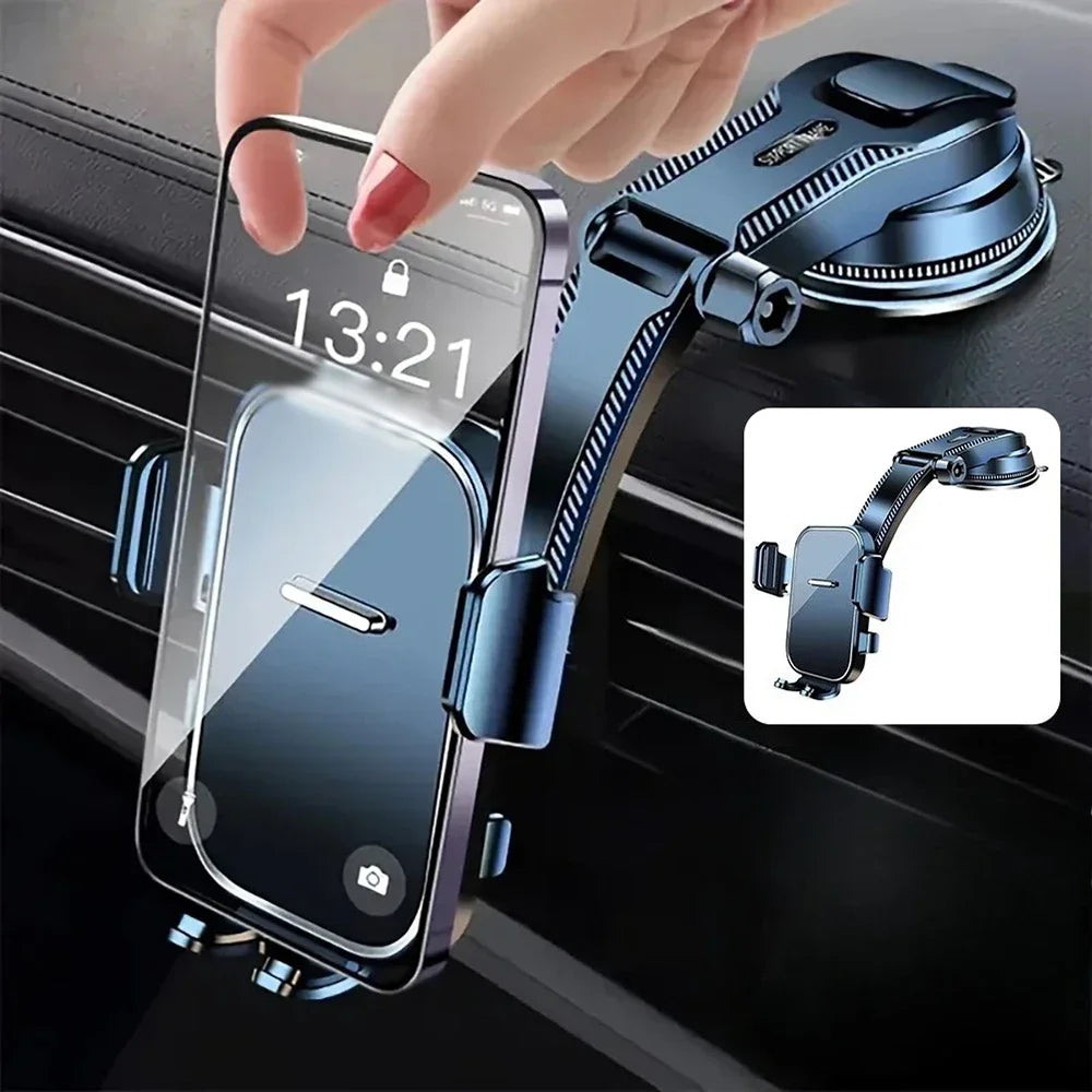 A hand holds a smartphone displaying 13:21, attached to a black car phone mount with an extension rod.