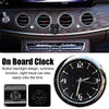 A stick-on car clock with a waterproof display showing the time on a dashboard.