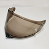 A clear motorcycle helmet visor with a brown tint is shown from a slight angle.