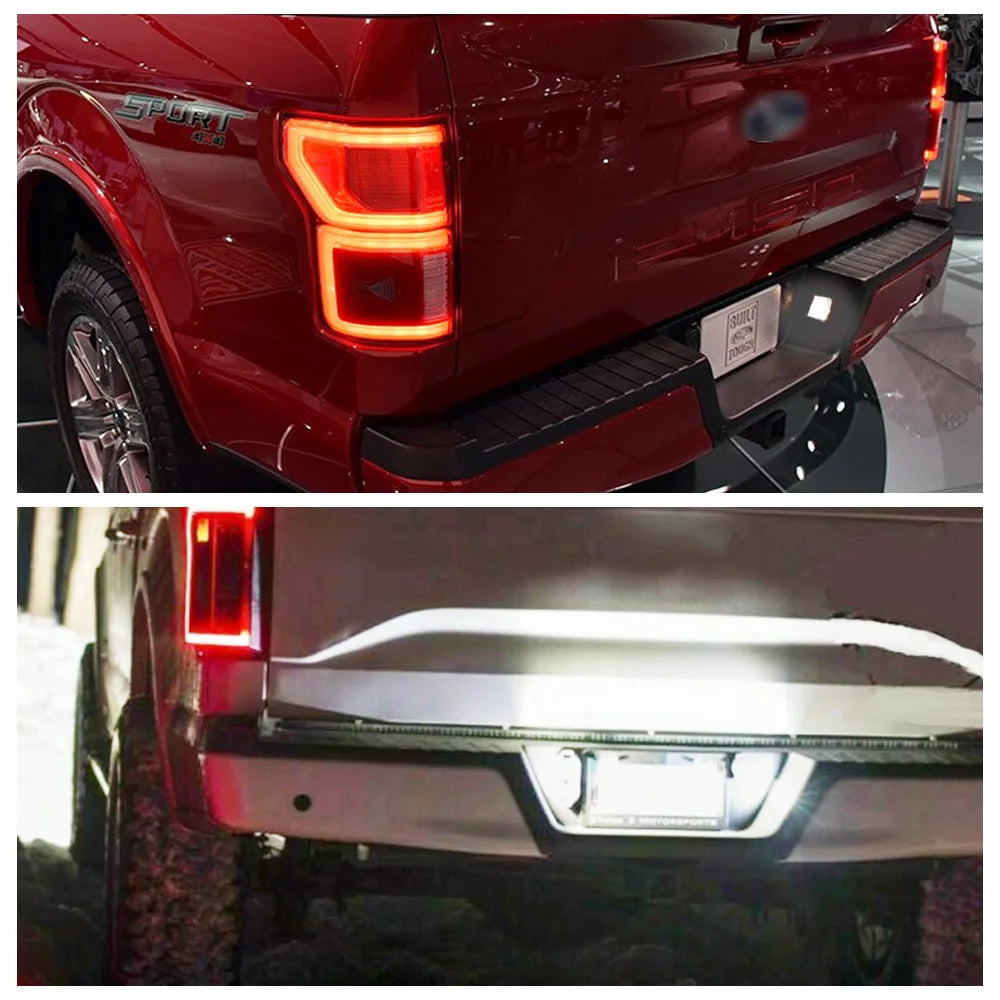 Rear view of a red Ford F-150 or Raptor showing LED license plate lights and taillights.