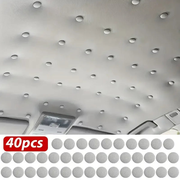 A collection of 40 small, round rivets used for repairing car roof headliners.