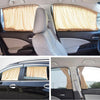 Interior view of a car showing a beige sun shade covering the side window.