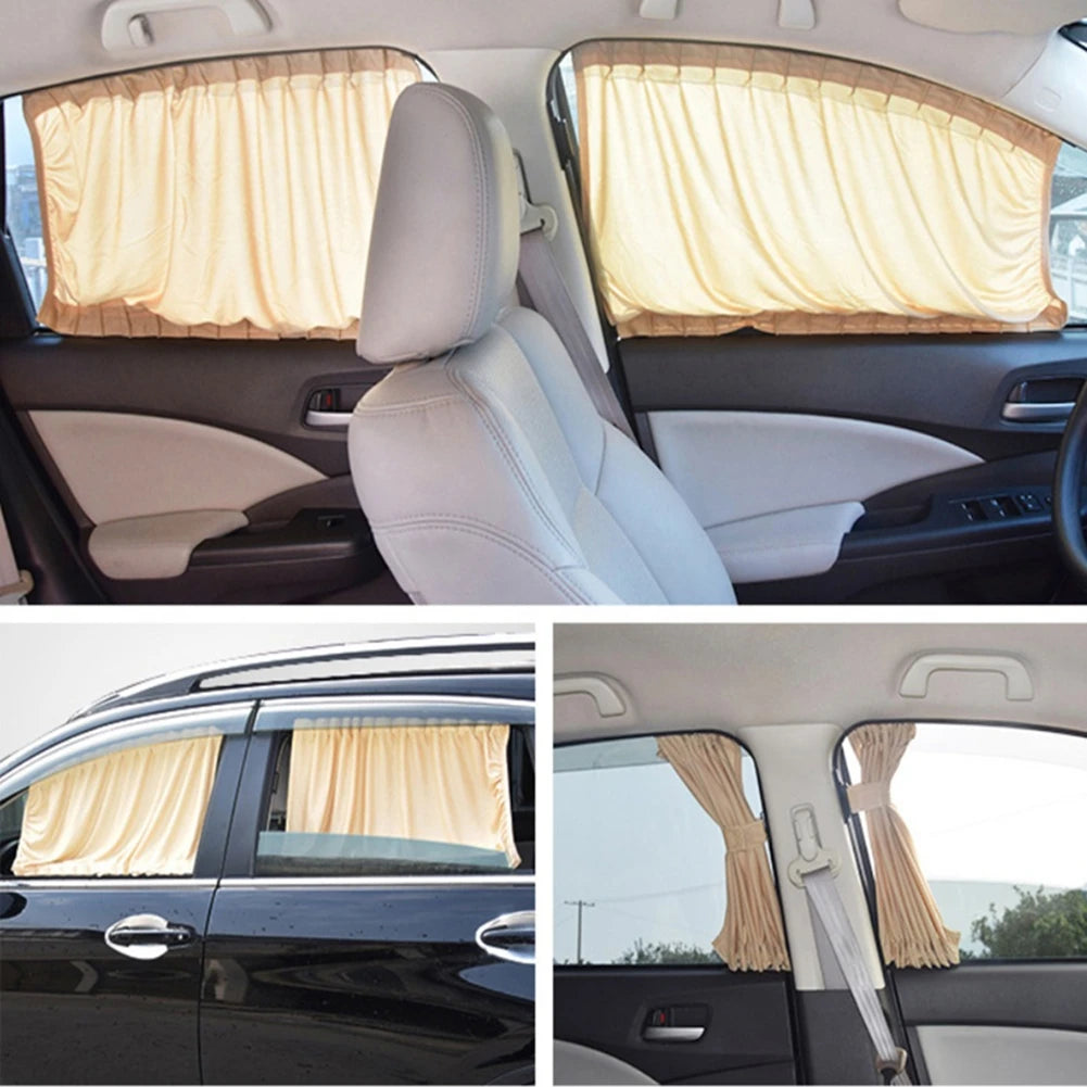 Interior view of a car showing a beige sun shade covering the side window.