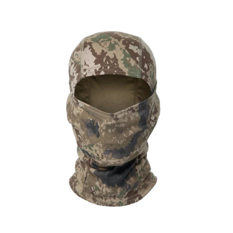 A camouflage balaclava cap worn on a head, featuring green and brown patterns.