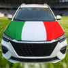 A white car hood decorated with the Italian flag design featuring green, white, and red stripes.