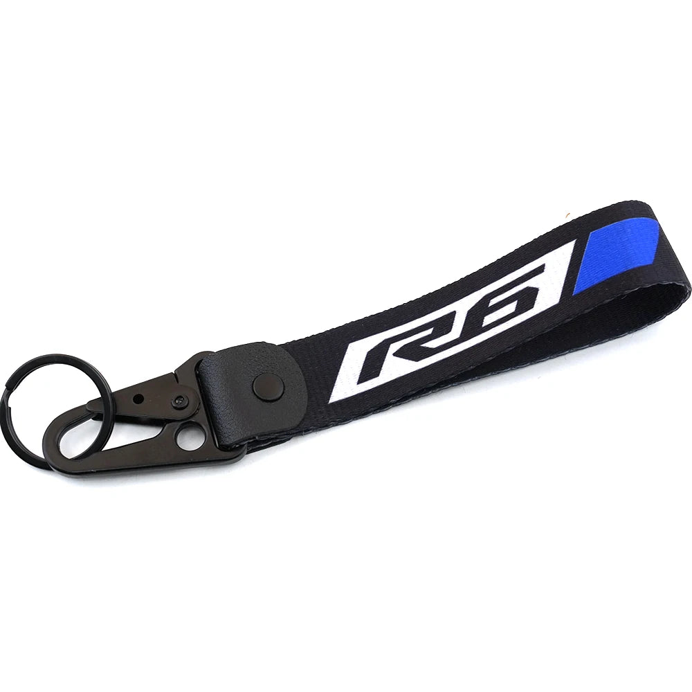 Cache du réservoir de liquide de frein noir et bleu de la moto R6 avec une boucle de clé USB.