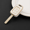 A white TPU car key fob cover for Honda, Toyota, and other keyless entry cars resting on a white plate.