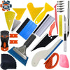 A collection of various tools and blades used for car vinyl tint film installation.