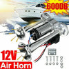 A silver 12V air horn kit with a large horn and mounting plate is shown against a bright sky.