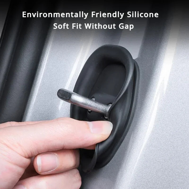 A hand is holding a black silicone door guard with a metal fitting, demonstrating its fit.