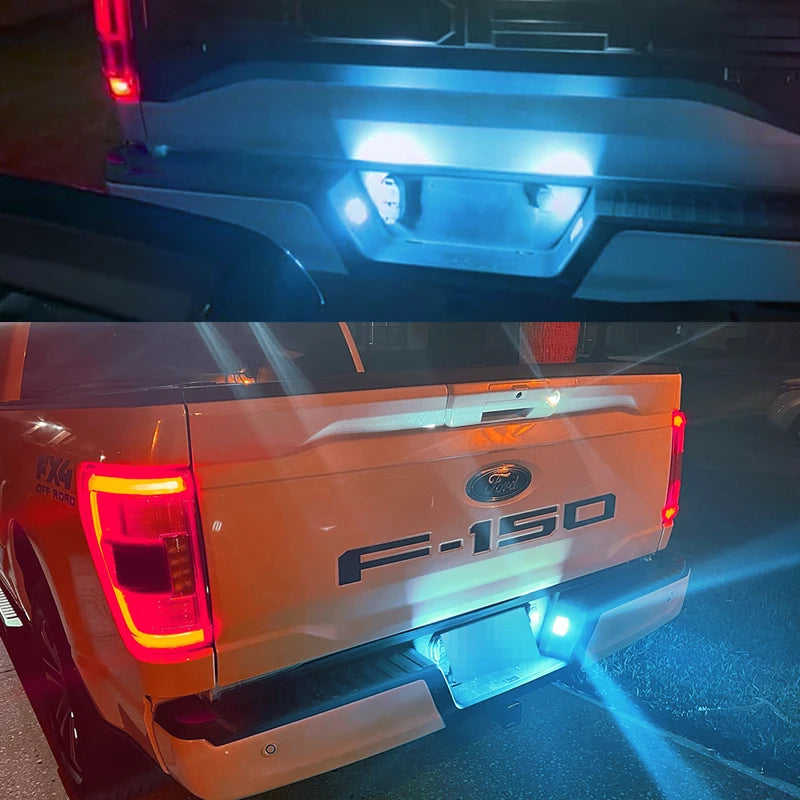 Rear view of an F-150 truck showing bright LED license plate lights and taillights.