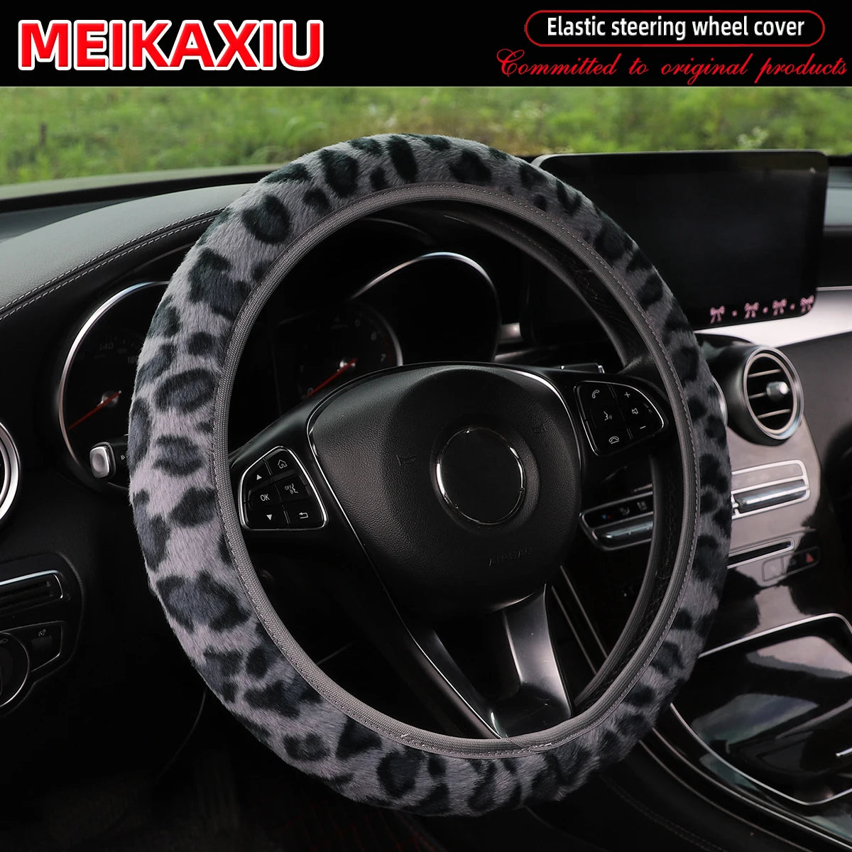 Leopard print plush steering wheel cover installed in a car interior.