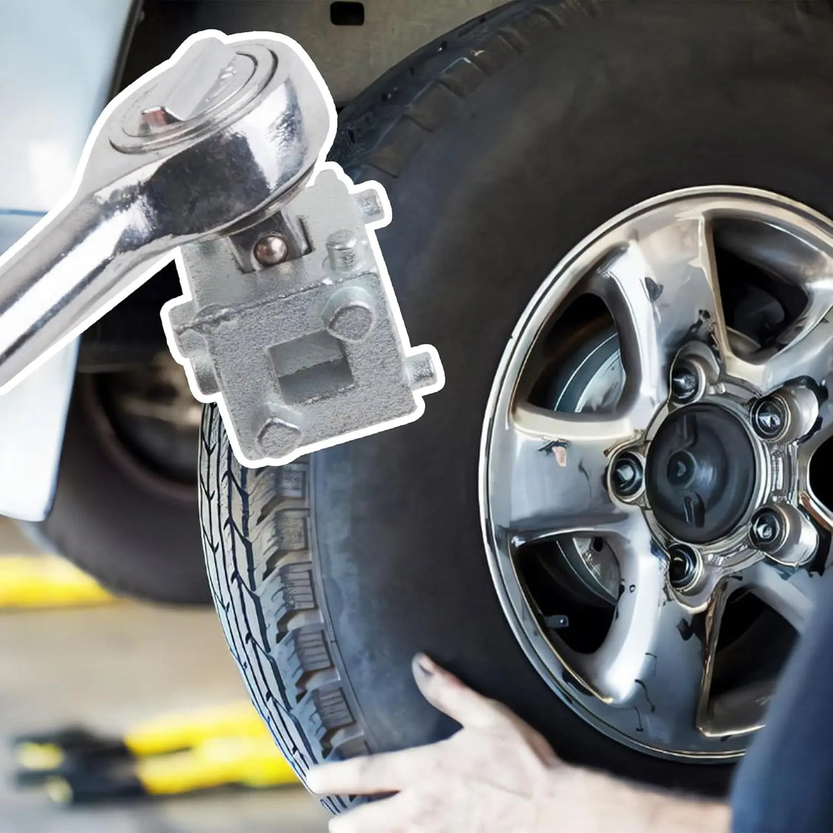A hand is using a tool to remove or adjust the caliper piston on a tire wheel.