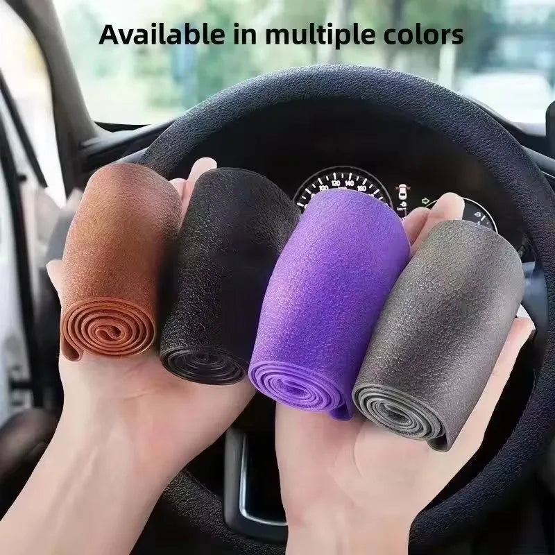Hands holding various colored silicone steering wheel covers inside a car
