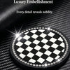 A black and white checkered diamond pattern coaster with a surrounding border of clear rhinestones on a textured surface.