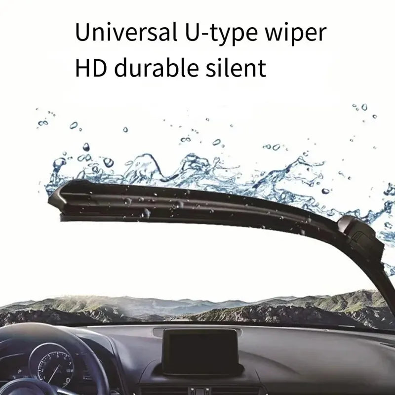A close-up view of a universal U-type wiper blade mounted on a car windshield, showing water spray and the interior dashboard