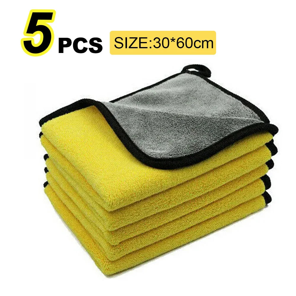 Five gray and yellow microfiber car washing towels stacked together
