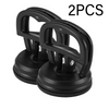 Two black suction cup dent puller tools shown against a white background.