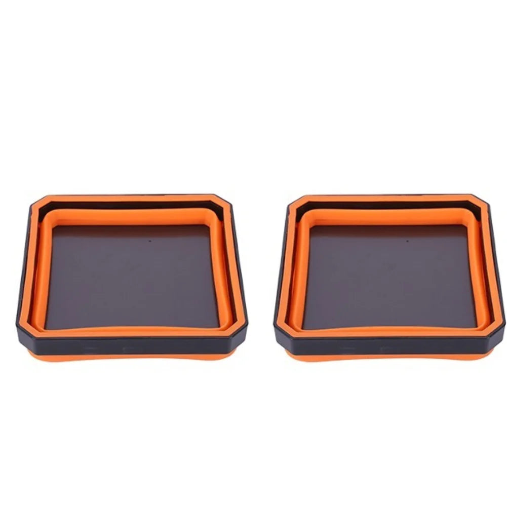 A pair of orange and dark gray collapsible magnetic parts trays for organizing small components.