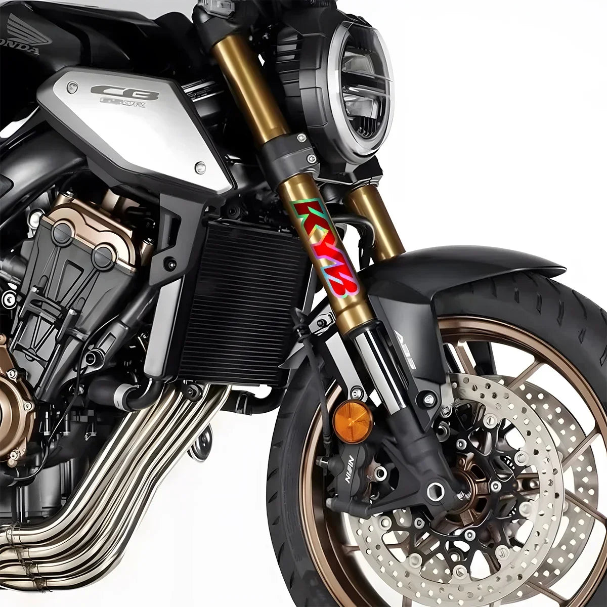 Close-up of a motorcycle engine and suspension featuring red and white racing decals on the fork.