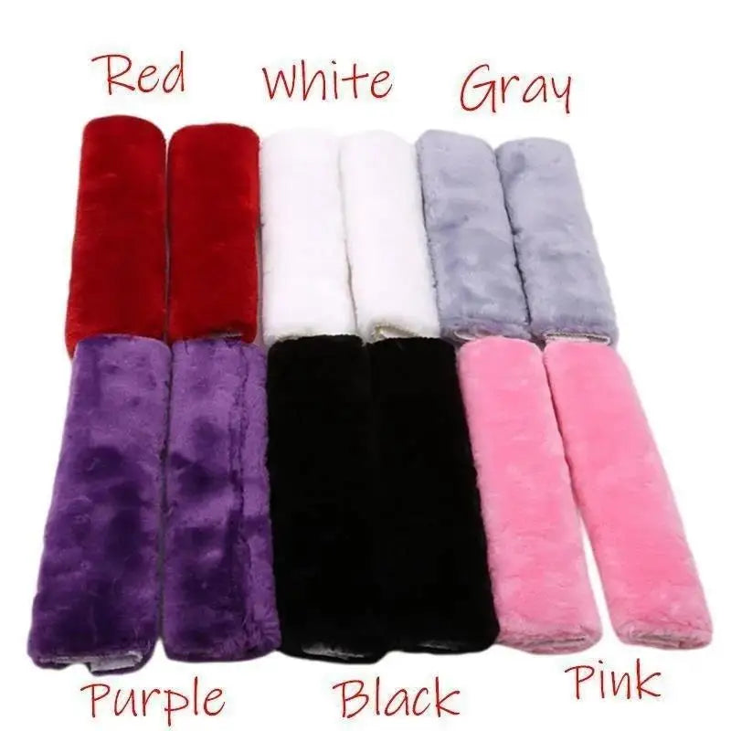 A row of luxury car seatbelt shoulder pads in red, white, gray, purple, black, and pink.