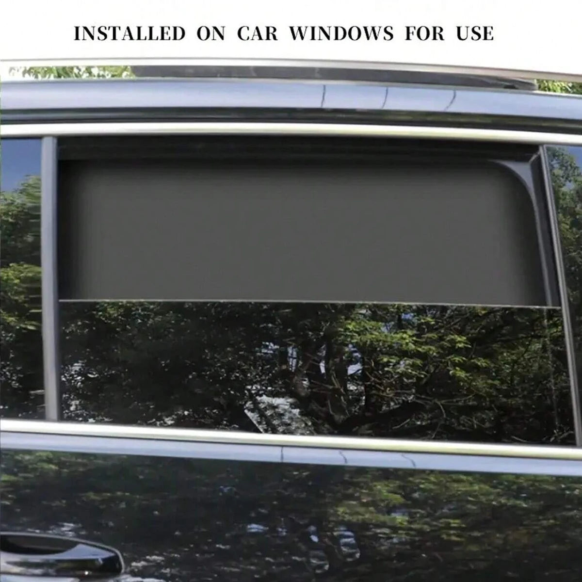 A magnetic car window sunshade installed on a vehicle window, obscuring the view outside.
