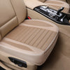Tan car seat covers showing a leather seat and a padded fabric seat cover.
