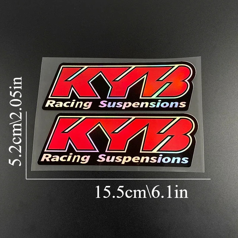 Two rectangular decals featuring the KYB Racing Suspensions logo on a black background.