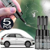 A hand is applying a windshield crack repair kit to a car, with several glass repair tubes visible.