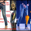 A pair of dark blue jeans featuring retro copper buttons and an Aramid zipper, shown alongside various protective features.