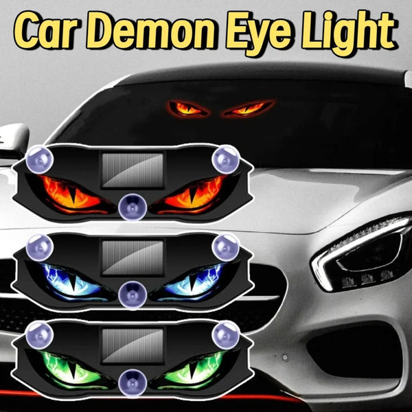 Close-up of a car headlight featuring demonic eye lights with glowing orange and blue accents.