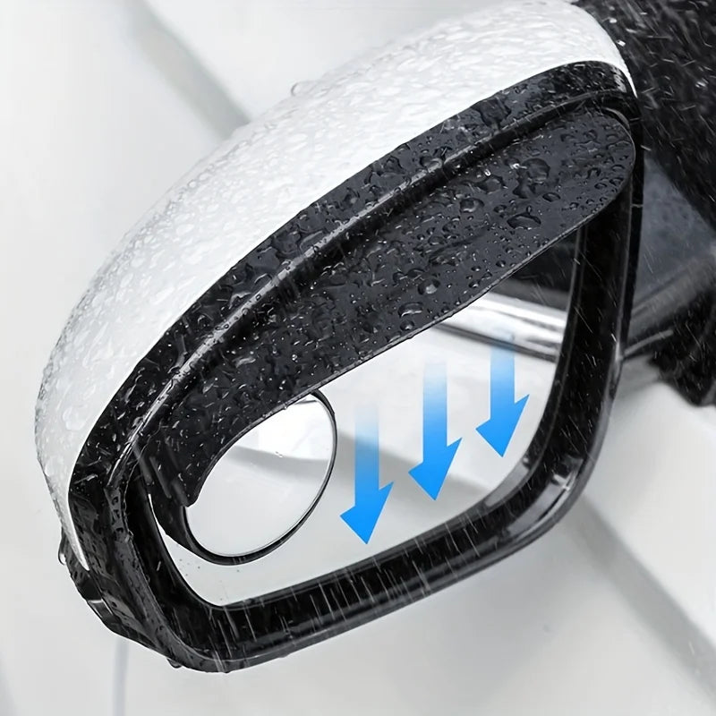 Close-up view of a black blind spot mirror with a clear lens and white rain shield, showing blue arrows indicating the viewin