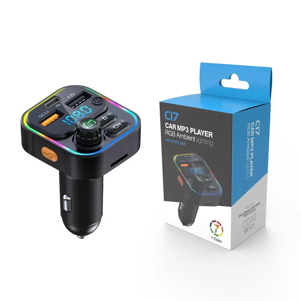 A black car audio device with an orange and green light, packaged in a blue box.