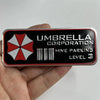 A close-up of a silver umbrella decal with the text Umbrella Corporation and Hive Parking Level 3 printed on it.