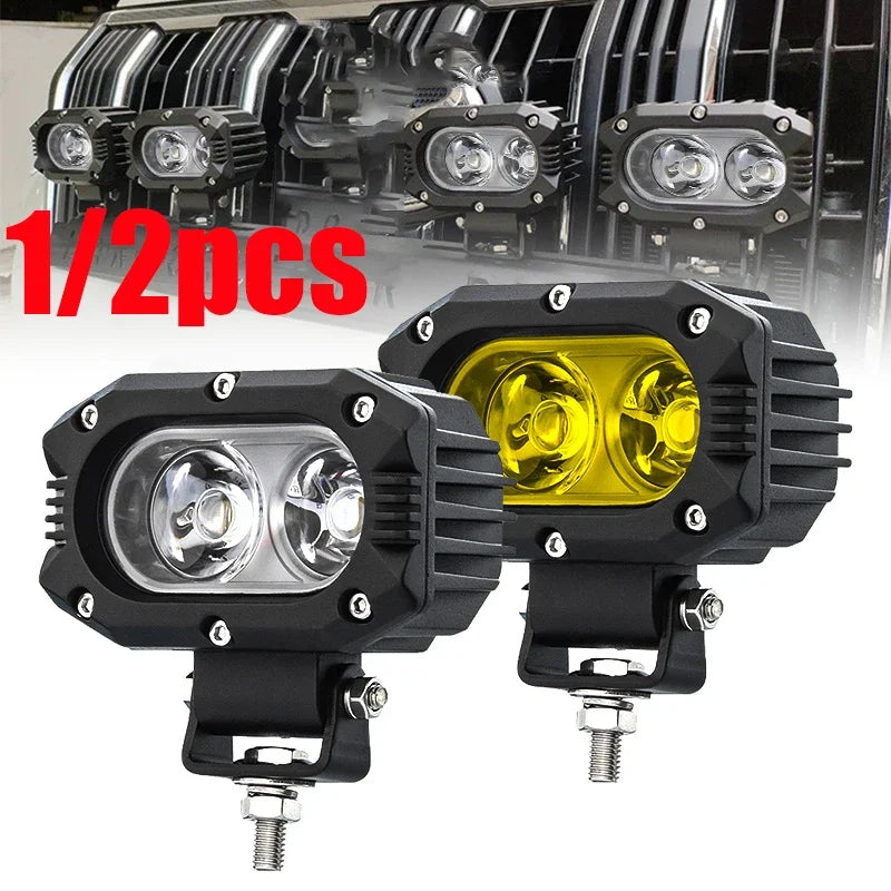 Two black LED work light mount brackets for vehicle hoods, shown against a background of automotive parts.