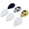 A set of three skull emblems in blue, chrome silver, and gold finish.