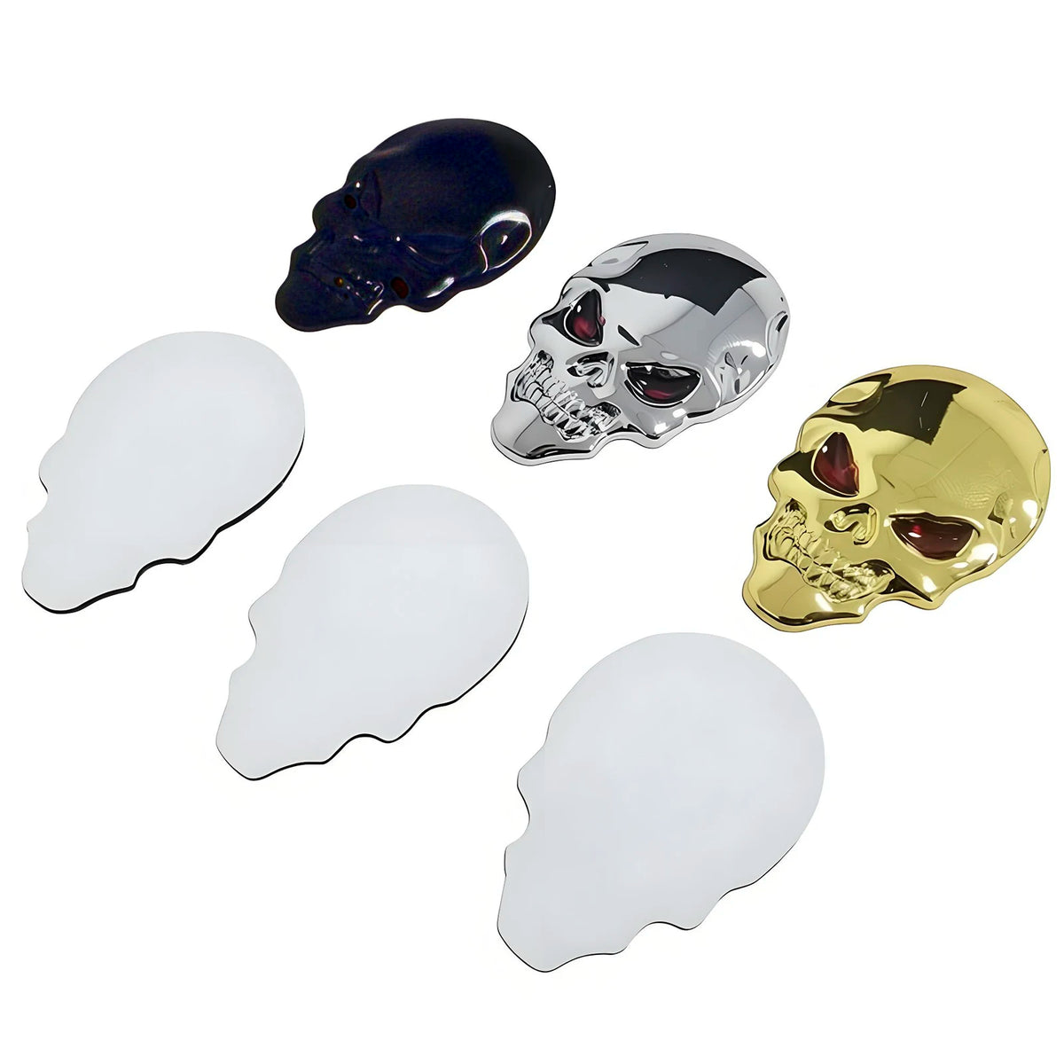 A set of three skull emblems in blue, chrome silver, and gold finish.