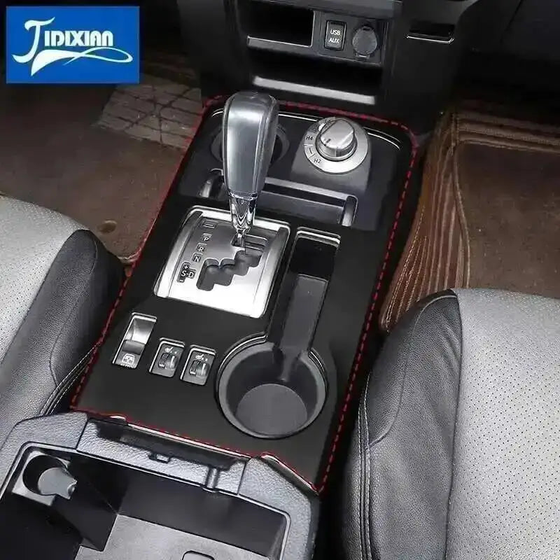 Carbon fiber grain interior decoration for a Toyota 4Runner showing controls and trim details.