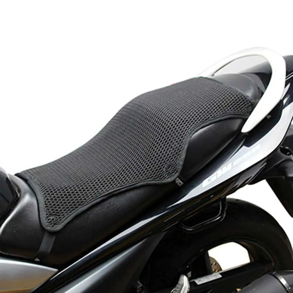 Black motorcycle seat cushion cover with white trim shown on a bike.