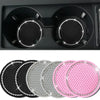 A set of five decorative rhinestone car coasters in black, silver, and pink.